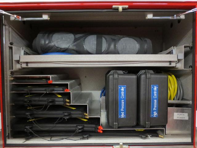Officers side compartment (P3) houses two Paratech MaxiForce medium pressure air cushions, nine Paratech MaxiForce high pressure lifting bags in various sizes, Paratech MaxiForce controllers for both sets of air bags and miscellaneous length air hose for the high pressure air bags 
