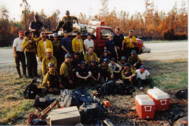 Ronnie and Ronnie pose with the group they were assigned with during the fires that ravaged part of Florida in the 90's
