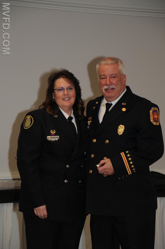 Outgoing Auxiliary President presenting President John Montgomery with Administrative Member of the Year Award.