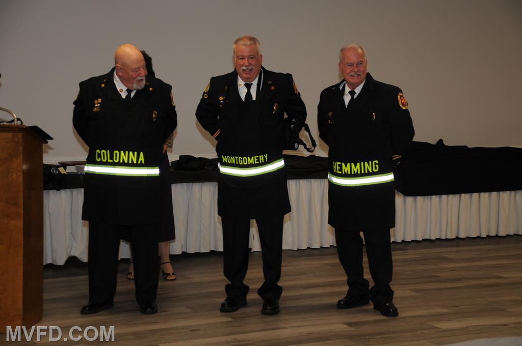 New aprons presented to Paul Colonna, John Montgomery and Bill Hemming for helping the Auxiliary in the kitchen.