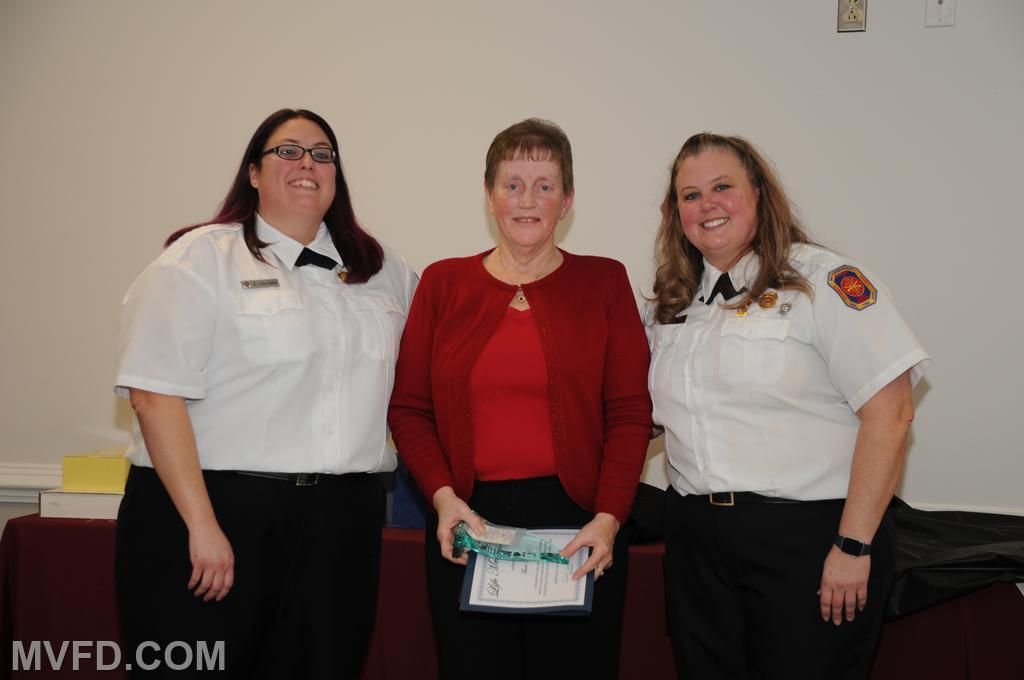 Auxiliary presenting Marie Kurtz with a certificate for 20 years of service and Life Membership.