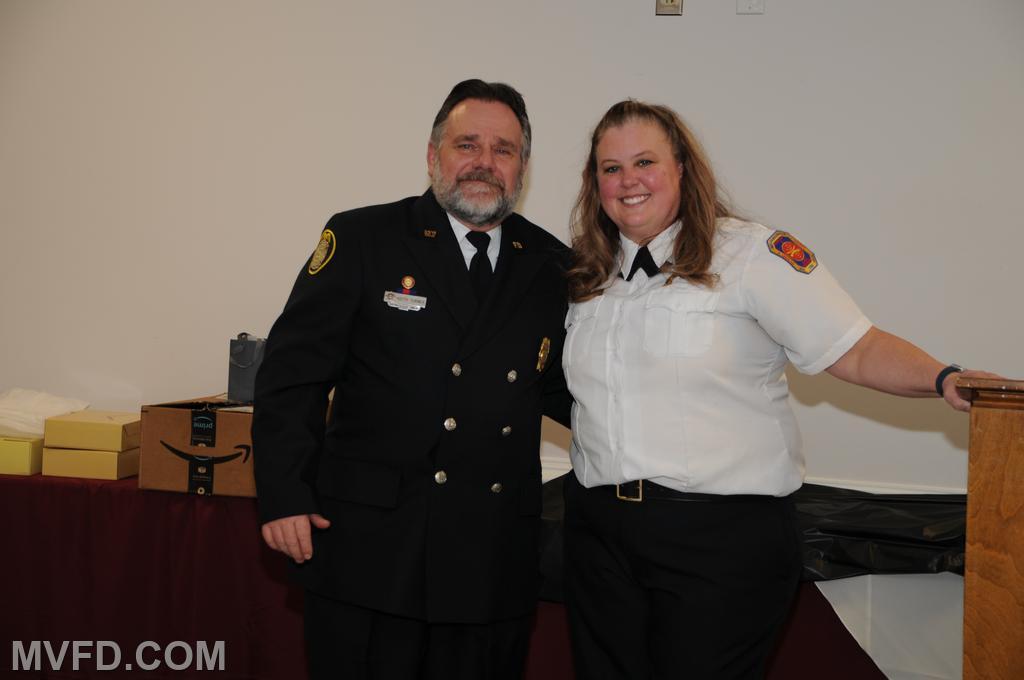 Auxiliary President Molly Colonna presenting Keith Turner with the Administrative Member of the Year pin.