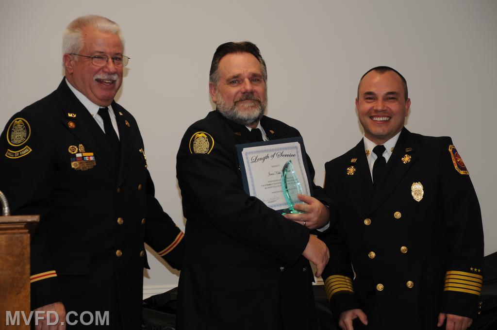 President and Chief presenting Keith Turner with a certificate for 5 years of service.