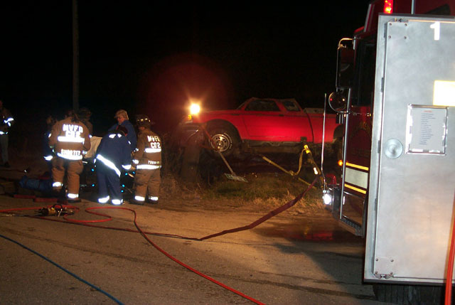 Fire and EMS personnel packaging the patient