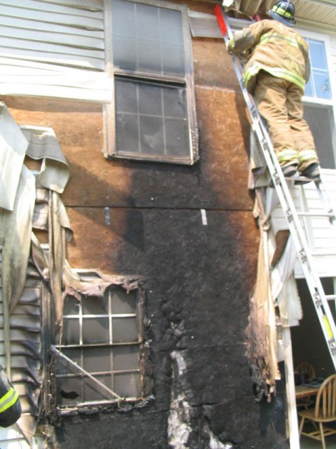 Crew from the Ladder Company removing the siding to check for extension