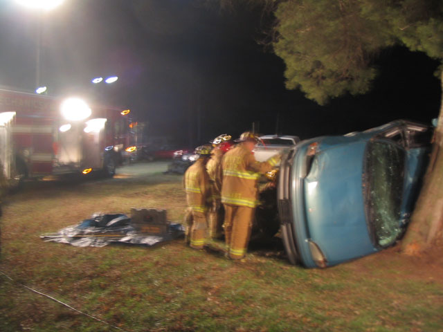 Squad and crew working on overturned vehicle