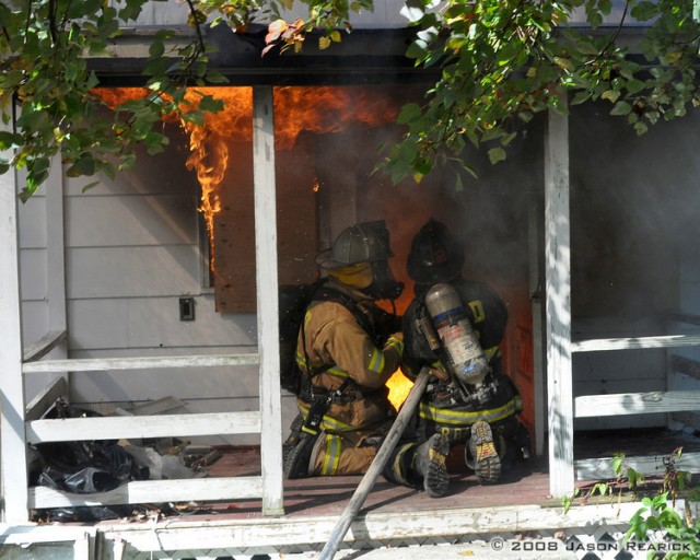 Firefighter Barnes and A/C Raley keep the fire in check while awaiting the next crew to advance on it